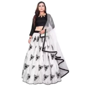 Woman wearing a black and white lehenga choli with floral printed skirt, long sleeve blouse, and sheer dupatta styled for festive and wedding occasions